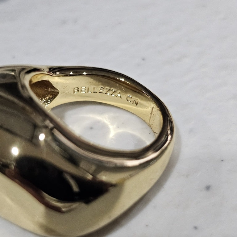 $35 Bellezza free form dome ring sz 5 New This Bellezza free form dome ring features a striking design with a smooth, polished surface that reflects light beautifully. Crafted in a rich gold tone, the ring showcases an organic, asymmetrical shape that pr