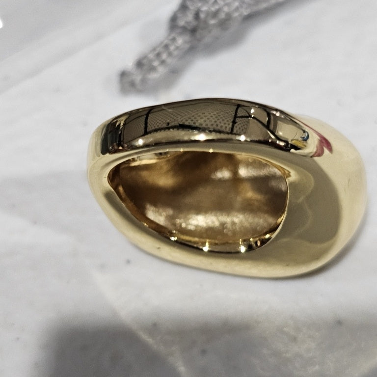 $35 Bellezza free form dome ring sz 5 New This Bellezza free form dome ring features a striking design with a smooth, polished surface that reflects light beautifully. Crafted in a rich gold tone, the ring showcases an organic, asymmetrical shape that pr