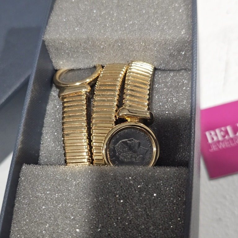 $125 Bellezza coin coil bracelet New This exquisite Bellezza coin coil bracelet showcases a unique design, combining classic charm with contemporary elegance. The bracelet features a series of intricate coils, highlighted by two distinct coin elements em