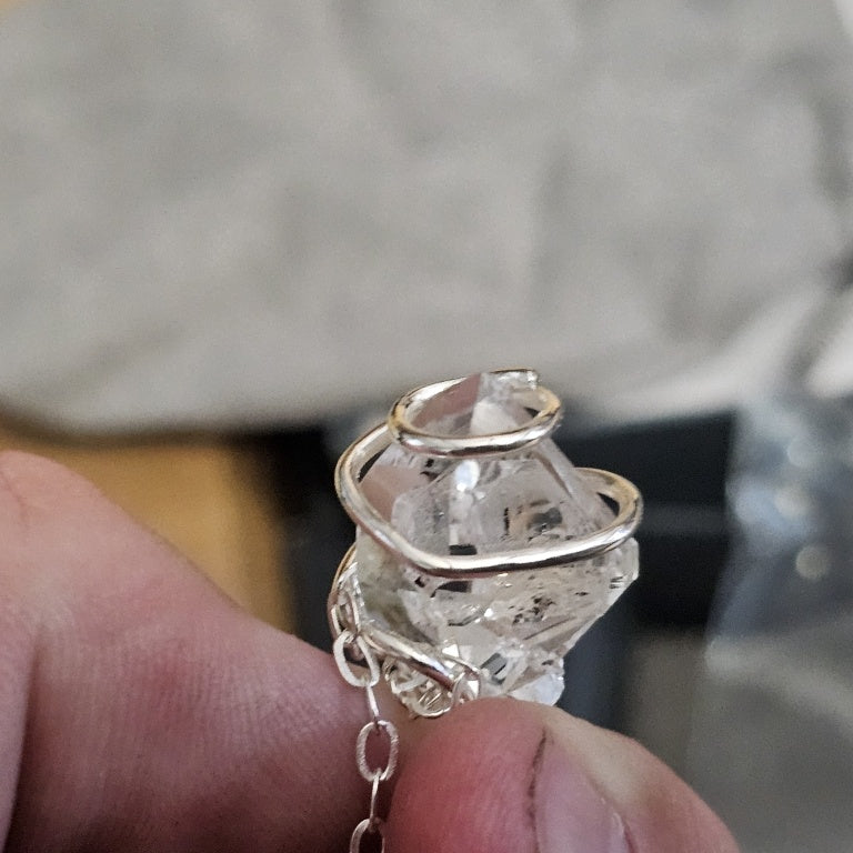 $130 double-terminated Herkimer diamond quartz cry New 878713 $130 double-terminated Herkimer diamond quartz crystal wrapped in a sterling silver cage