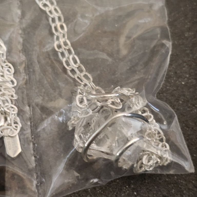 $130 double-terminated Herkimer diamond quartz cry New 878713 $130 double-terminated Herkimer diamond quartz crystal wrapped in a sterling silver cage